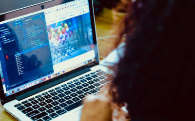 Team at a computer reviewing issues in a free bug tracking tool