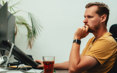 Client doing user acceptance testing on a new website at his desk